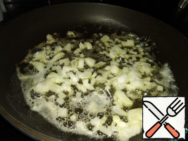 Fry the onion in half the butter.