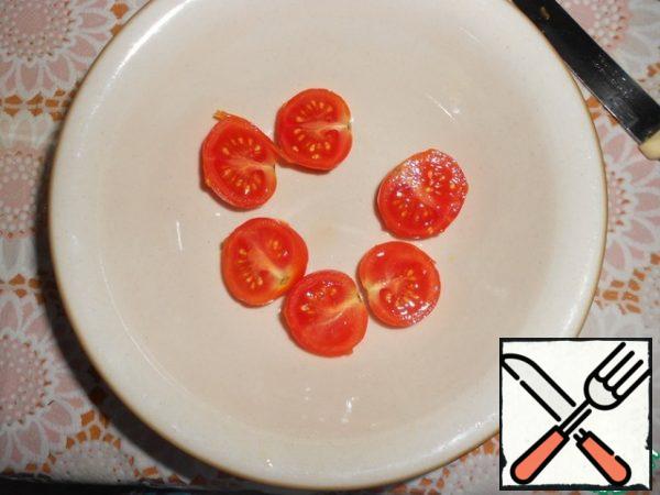Cherry tomatoes cut into halves.