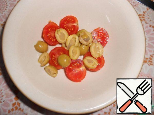 Cut the olives lengthwise into halves.