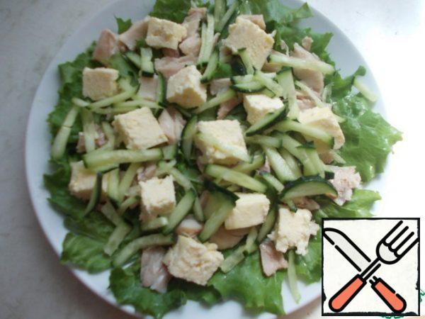 Cut the cucumber into strips and put it on top of everything.