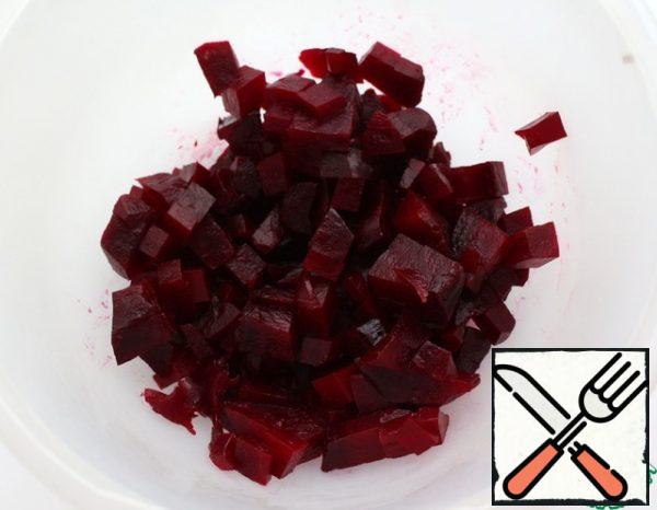 Boil the beets or bake them in the oven until tender. Peel and cut into small cubes.