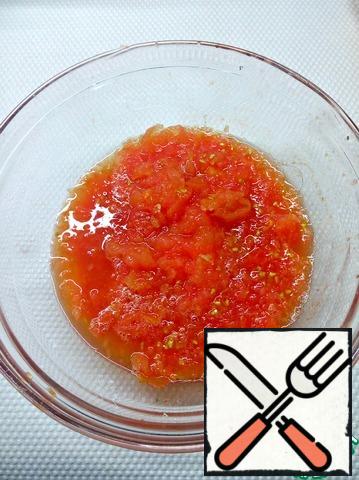 Grate the tomatoes and discard the skin.
