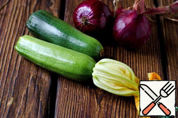 For the filling, we need zucchini and red onion.