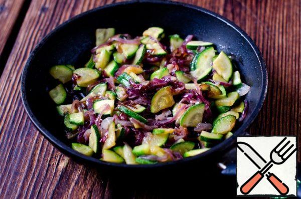 Add zucchini to it and also fry until browned.
