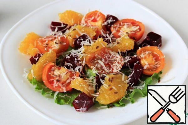 Drizzle the salad with olive oil and sprinkle with grated Parmesan and flax seeds.