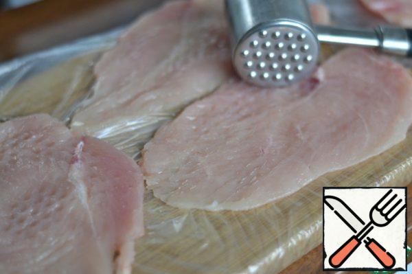 Cut the chicken Breasts into chops.
Lightly beat off.