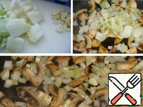 Finely chop the onion and garlic and add them to the mushrooms. Fry for a few minutes.