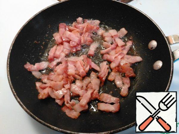Finely chop the bacon and fry.