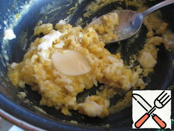 Cook, stirring occasionally. Do not overdo it, the omelet should be tender. Remove from the heat and add the butter.