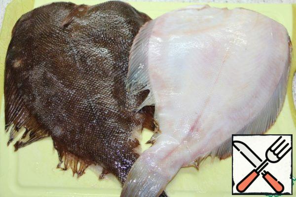 Wash flounder carcasses, gut them, and cut off the fins.
