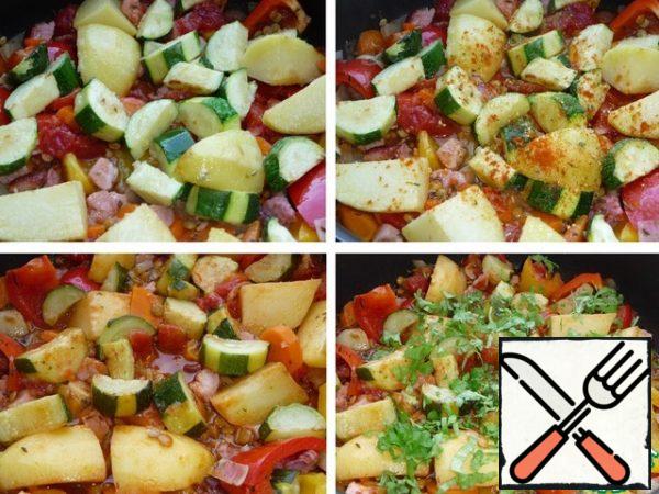 Put the potatoes and zucchini in a frying pan, add red hot pepper and vegetable seasoning and pour boiling water. Adjust the amount of water as needed. Simmer, after boiling, under a lid on low heat for 20 minutes. (until the lentils are ready). Add the greens to the finished stew.