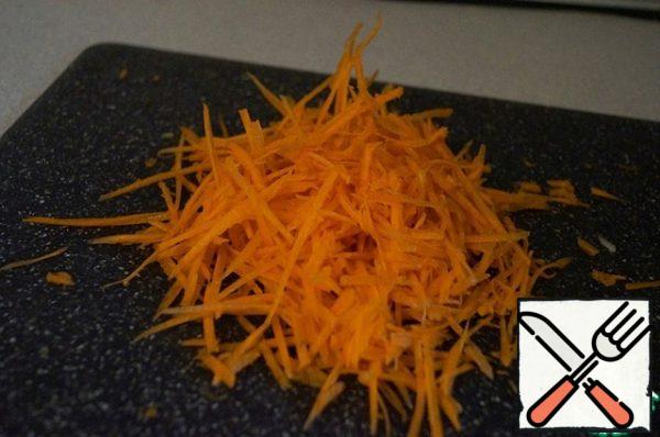 Grate the carrots on a Korean carrot grater or simply cut into strips.