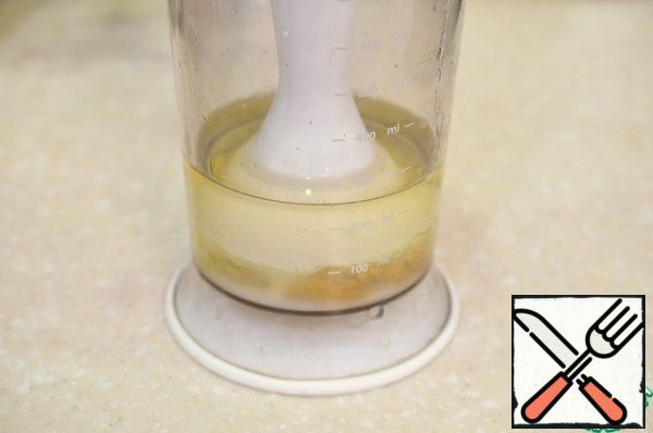 Cover the yolk with the" leg " of an immersion blender.