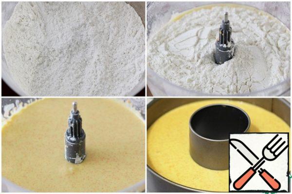 Mix flour with baking powder and salt.
Add the flour mixture to the bowl of the food processor and beat again.
Put the finished dough in a greased form (the diameter of the form is 22-24 cm).