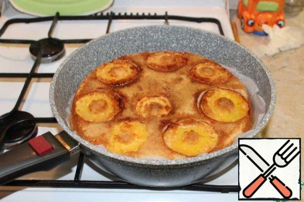 Turn over the cake using the parchment and plate. Cook for another 5-10 minutes.