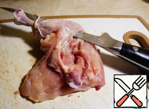 Use a thin knife to cut the meat near the bone.