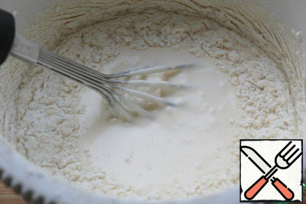 Gently introduce the flour, stirring with a whisk.
