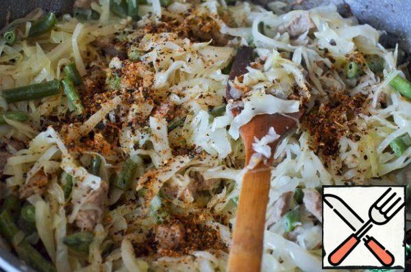 Add dry adjika, stir, and simmer under the lid until tender.