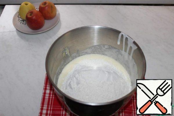 Add the sifted flour with baking powder.