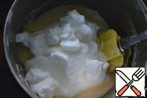In a separate bowl, beat the egg yolks and add to the egg mixture.