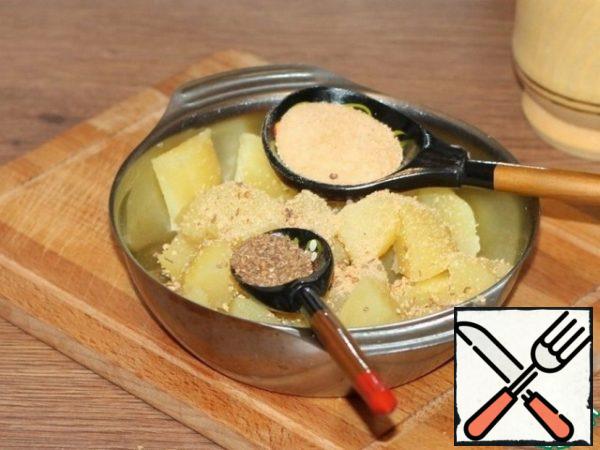 Put the potatoes in a bowl and sprinkle with: breadcrumbs and ground seasoning (coriander, cumin), salt and mix gently.