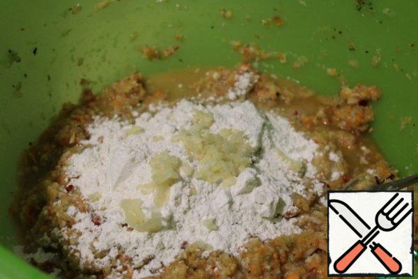 Then add the flour (sifted) and garlic passed through the press.