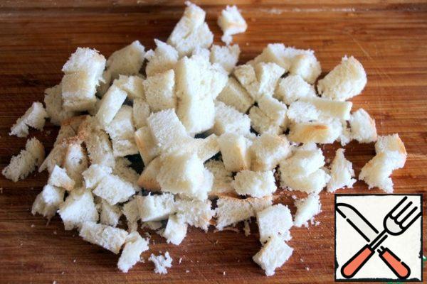 Dried white bread cut into cubes.