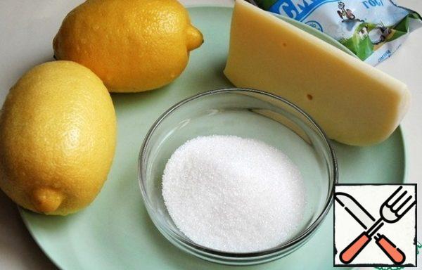 Carefully wash the lemon, sour cream is better to take in a package, so it is more convenient to distribute it on a lemon with sugar. Any hard cheese, with an unobtrusive aroma and taste, I have "Dutch".
