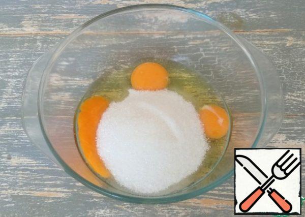 Combine eggs with sugar.