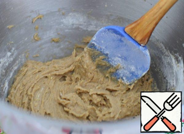 The dough is thick. It holds steady on a spatula or spoon.