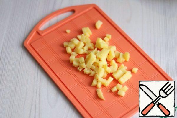 Boil potatoes (1 PC.) until tender, cut into small cubes.