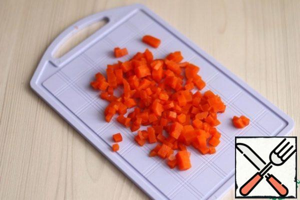 Boil the carrots and cut them into small cubes. Boil the beets and cut them into small cubes.