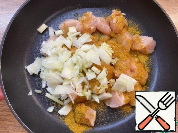 Add salt to taste (about 1/4 tsp), chopped onion (1 small onion), crushed (or grated on a fine grater) garlic (2 cloves), dry Curry seasoning (1 tsp).