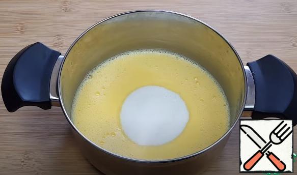 Add milk to the yolks and stir well, then add sugar and 50 grams of butter and put on the stove to cook (until thick).
