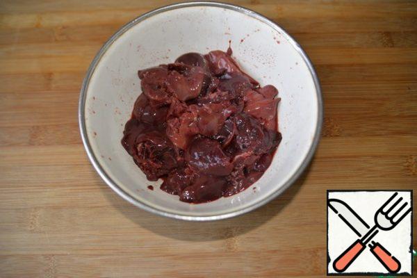 Chicken liver is washed, stripped of streaks.