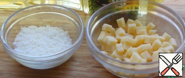 Grate the Parmesan cheese.
Cut the cheese into small cubes.
Cut the greens - I took parsley and dill without stalks and green onions.