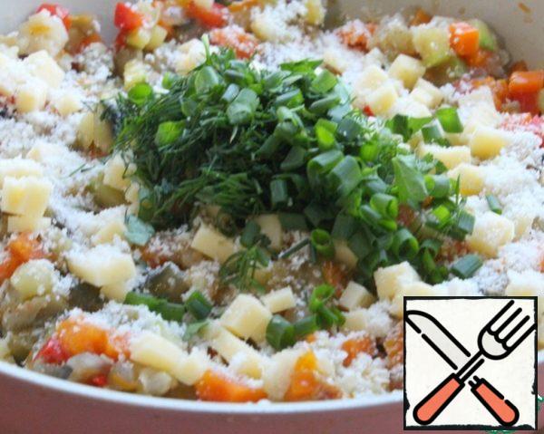 Add both cheeses and herbs.
Cut the tomato into small cubes, add and mix everything together.
Adjust for salt and pepper.