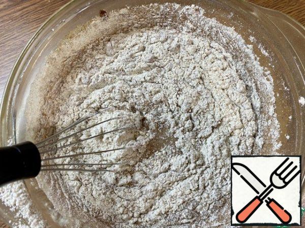 Add 80 g of wholegrain and rye flour through a sieve.