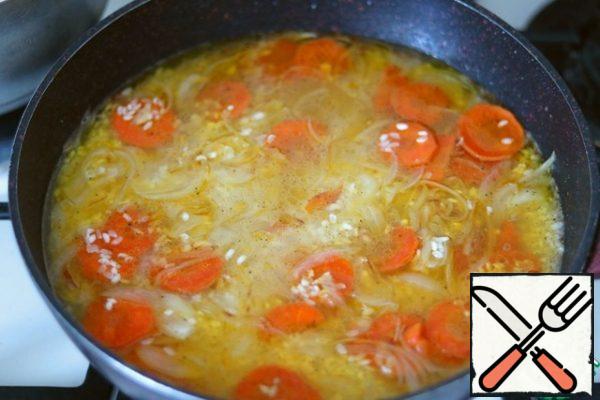 Add rice to the sauteed vegetables. Then add water, so that it slightly covers the rice.