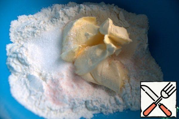 Add soft butter, salt, and sugar to the flour.