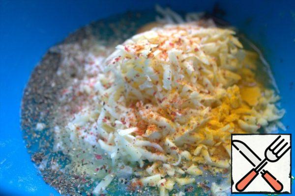 Grate regular cheese and add spices.