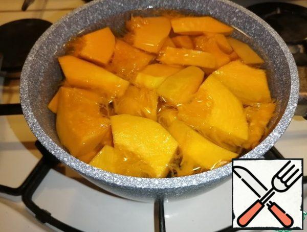 Cut the pumpkin into large pieces, put it in a saucepan, cover with water and boil until tender.