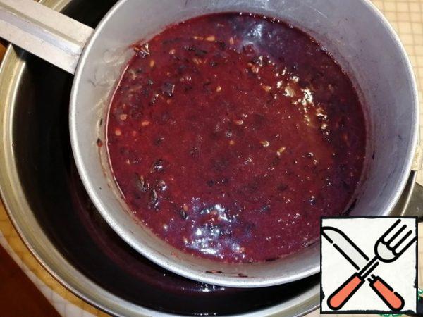 Place in the bowl of a blender along with the bones and twist. RUB into a saucepan through a sieve or colander.