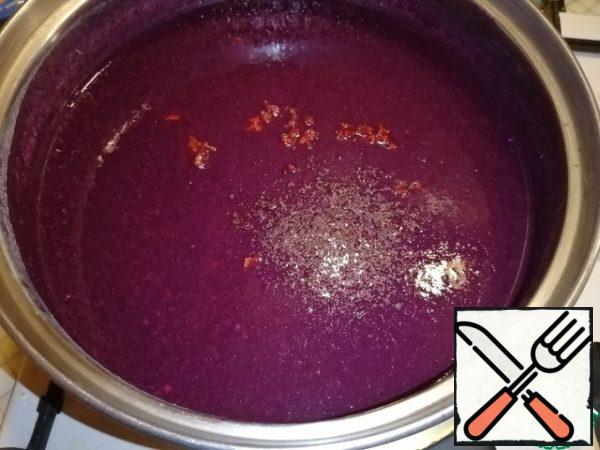 Add the finely chopped red hot pepper, cloves, and black pepper to the pan. Pour in the grape vinegar. Cook for 10-15 minutes, stirring occasionally. Close in sterilized jars. Done.