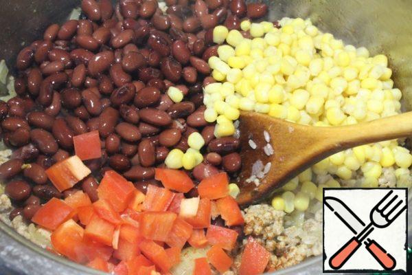 Add spices, beans, corn, bell pepper, salt and mix.