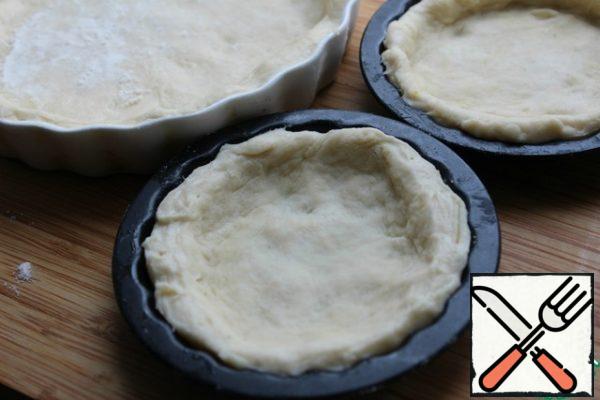 Knead the dough quickly - it is soft and pliable. If they do, (depending on the cheese) then add the flour.
Spread the dough into shapes or on parchment with your hands.