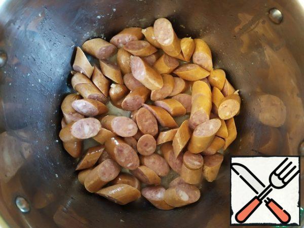 Then fry the sausages and also set them aside.