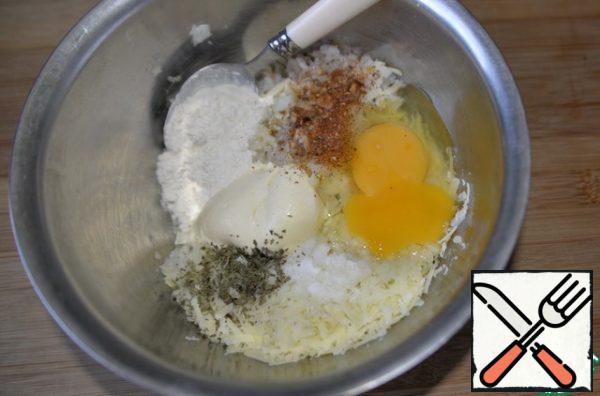 Put the egg, salt, pepper mixture, herbs (I have dry parsley). Add sour cream or mayonnaise, flour or starch.