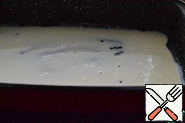 Lightly pour the sour cream mixture over the bottom of the prepared baking dish.