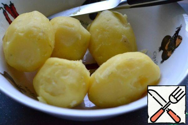Cook potatoes in a uniform.
Allow to cool and peel.